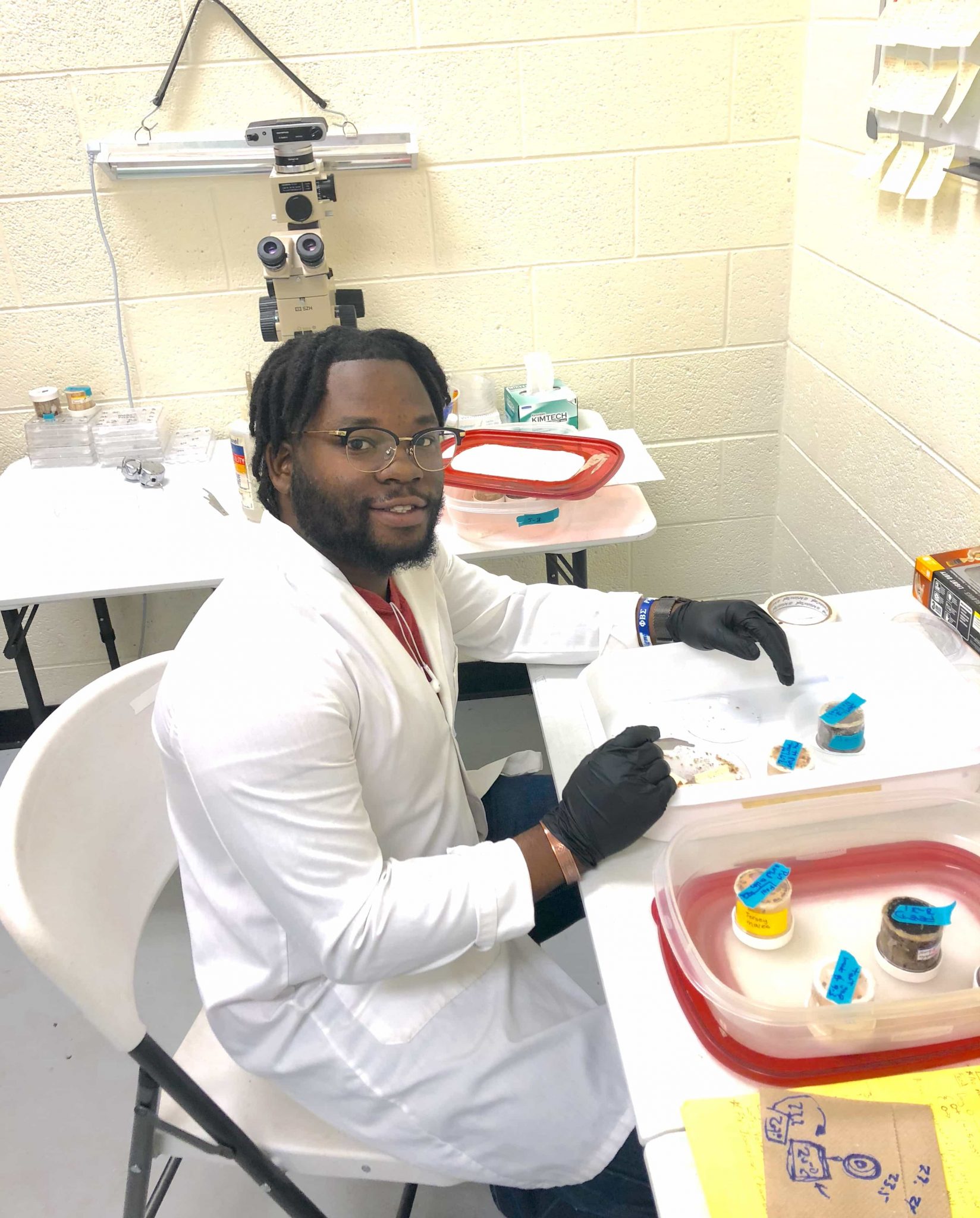 man sitting in a lab
